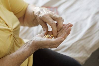 Woman's hands holding pills