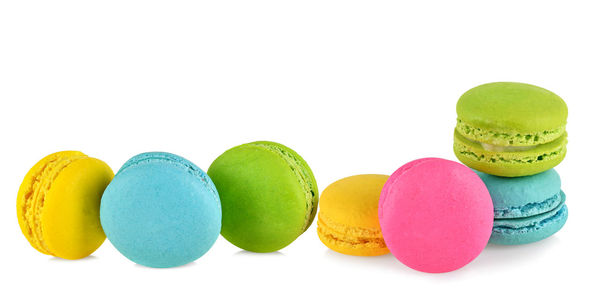 Close-up of multi colored candies against white background