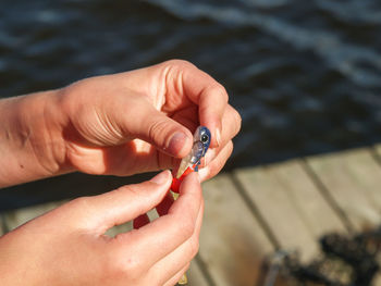 Close-up of woman hand holding water