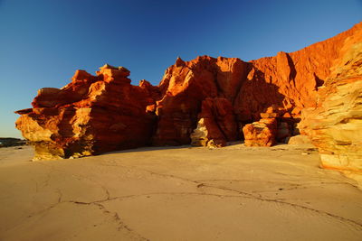 Rock formations on mountain against sky