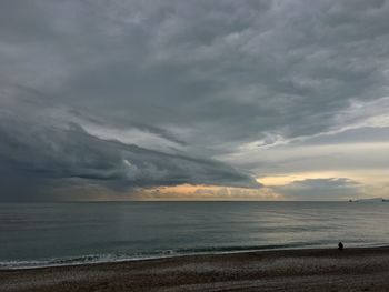 Scenic view of sea against sky at dusk