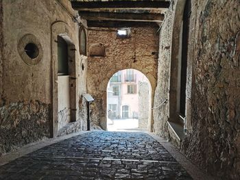 Narrow alley along old building