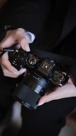 Cropped hand of man using mobile phone