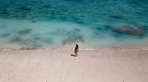 High angle view of shirtless man on beach