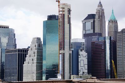 Modern buildings in city against sky