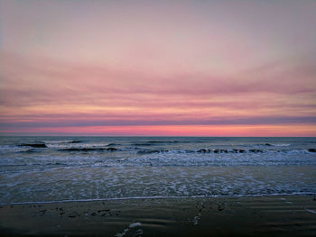 Scenic view of sea against sky at sunset