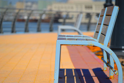 Close-up of resting chair next to waterfront