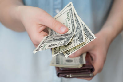 Close-up of hand holding paper