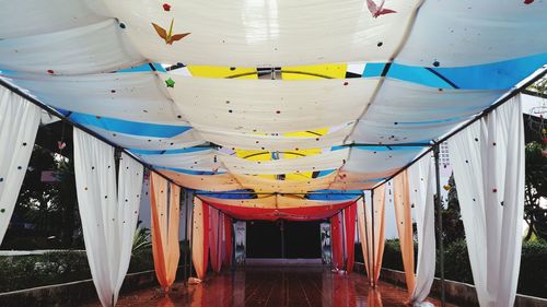 Multi colored umbrella against building