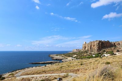 Scenic view of sea against blue sky