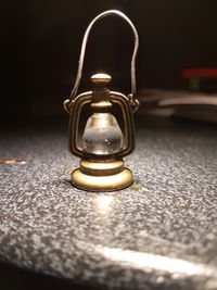 Close-up of electric lamp on table