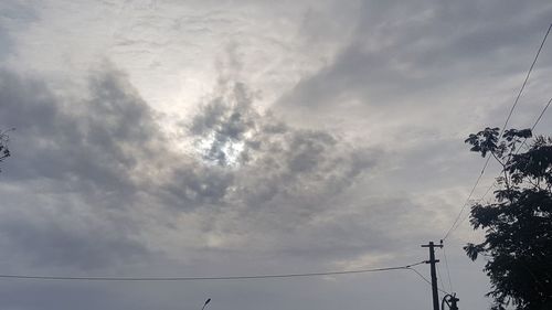 Low angle view of electricity pylon against sky