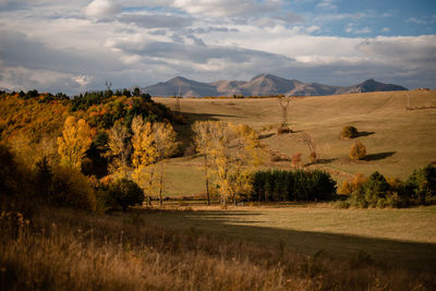 Scenic view of autumn landscape of mountains against the sky