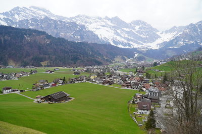 Scenic view of townscape and mountains