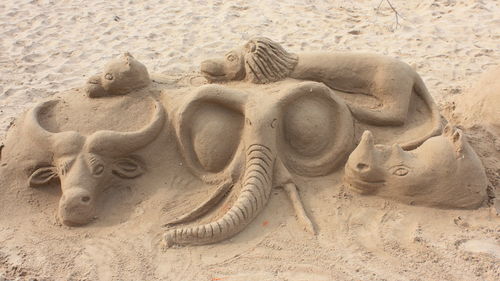 Close-up of sculpture on sand