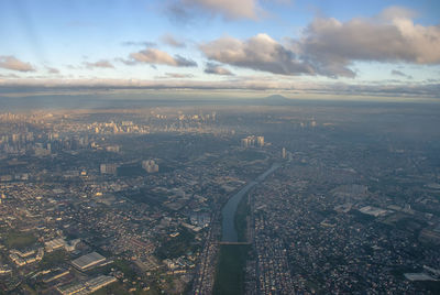 High angle view of illuminated city buildings against sky
