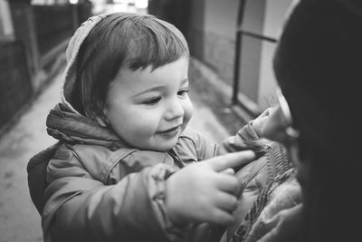 Close-up of cute boy in warm clothing outdoors