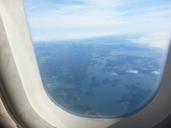 Aerial view of landscape seen through airplane window