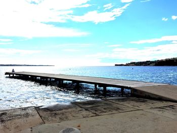 Scenic view of sea against cloudy sky