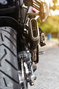 Close-up of bicycle parked on road