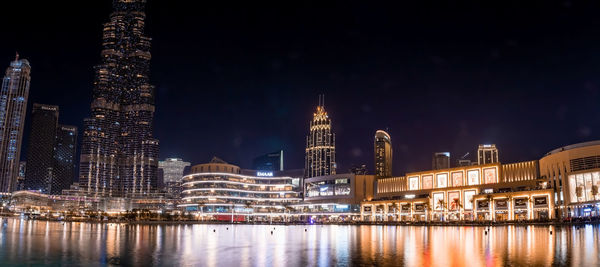 Illuminated buildings in city at night