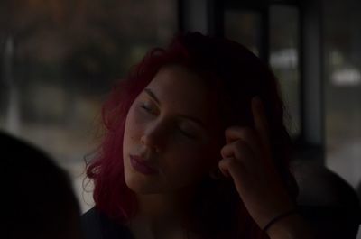 Close-up portrait of a young woman looking away