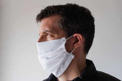 Man wearing homemade cloth face mask during covid 19 pandemic.