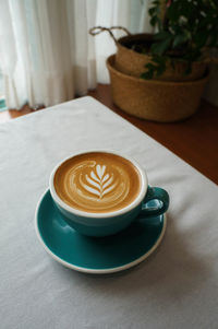 Close-up of cappuccino on table