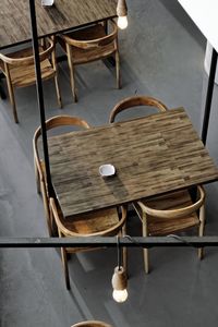 High angle view of empty chairs and table in restaurant