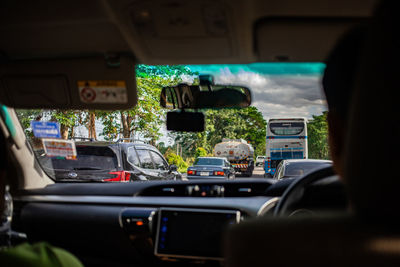 Rear view of vehicles on road