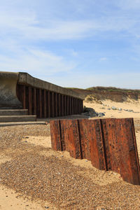 Built structure on sand against sky