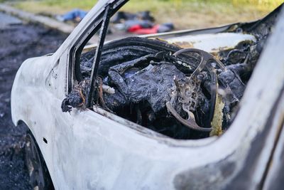 Close-up of abandoned rusty car