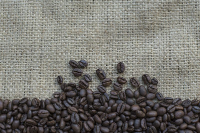 High angle view of coffee beans on burlap