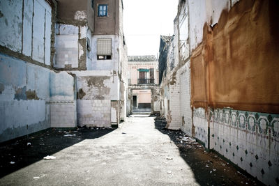 Narrow alley amidst buildings in city