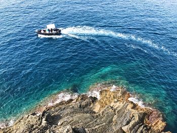 High angle view of ship sailing in sea against sky