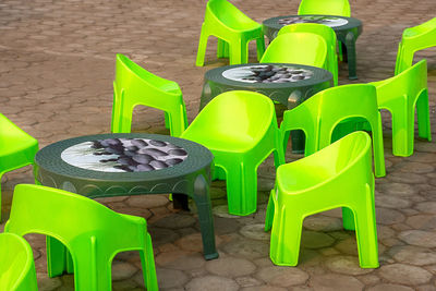 High angle view of empty chairs and table