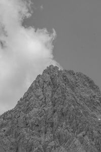 Low angle view of rock formation against sky
