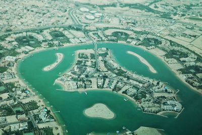 Aerial view of city by sea