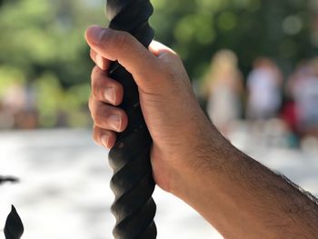 Close-up of man holding hands