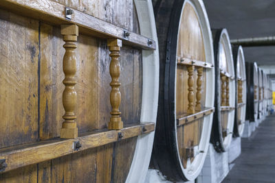 Barrels of wine in wine cellars close-up