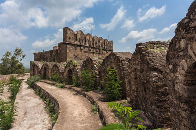 Old ruin building against cloudy sky