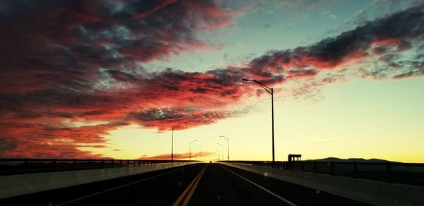 Road against dramatic sky during sunset