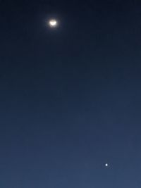 Low angle view of moon against sky at night