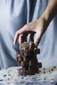 Midsection of man holding cake