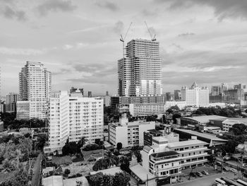 High angle view of buildings in city against sky