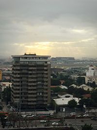 High angle view of buildings against sky during sunset