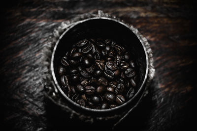 Close-up of roasted coffee beans on table