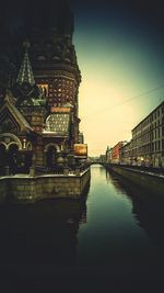 River in city against clear sky