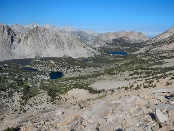 Scenic view of rocky mountains against clear blue sky