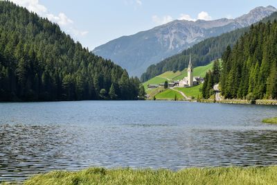 Scenic view of lake and mountains against sky